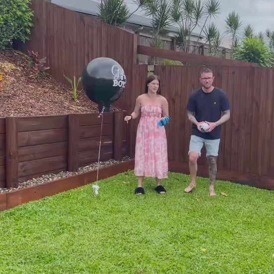 gender reveal AFL foot australian football league he or she baby shower boy or girl powder smoke explosion it's a boy girl 